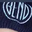 The emblem on Navy knit beanie with the disc embroidered in white, The Bend Store, March 1, 2020.