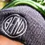 The emblem on Black knit beanie with the disc embroidered in white, The Bend Store, March 27, 2021.
