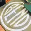 The emblem on Olive tee with a white disc, a black tumbler, and a camo hat with a disc patch, The Bend Store, June 20, 2021.