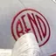 The emblem on Gift basket: trucker hat with red BEND disc and maroon mug with white BEND disc, The Bend Store, November 25, 2022.