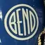 The emblem on Gift basket: a blue mug with a white disc and a grey trucker hat with a black one, The Bend Store, November 25, 2022.