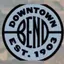 The emblem on “COMMUNITY TREE LIGHTING” event poster shown as reel end card, Downtown Bend Business Association, November 30, 2022.