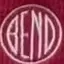 The emblem on Maroon beanie with the disc embroidered in white, and folded tees carrying it, The Bend Store, April 6, 2023.
