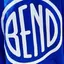The emblem on Two children in blue and olive hoodies carrying large white discs, The Bend Store, June 23, 2023.