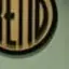 The emblem on The wooden disc on the chamber wall, behind the councillors and beside the flag, KTVZ NewsChannel 21, September 5, 2024.