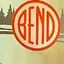 The emblem on Door-glass decal: the shop’s lockup with the disc in red, The Bend Store, June 8, 2025.