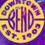 The emblem on First Friday promo graphic (purple galaxy), Downtown Bend Business Association, September 5, 2025.