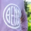 The emblem on Lavender long-sleeve tee with a large white disc, The Bend Store, November 28, 2025.