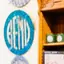 The emblem on Blue wall discs beside the counter, and the disc on a staff apron, The Bend Store, January 26, 2026.