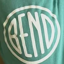 A hand-drawn white disc on green cloth: the word BEND in narrow letters inside a wobbling ring.