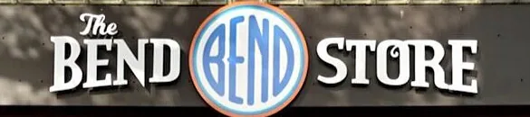A shop sign reading The BEND STORE, with a circular BEND emblem between the two words.
