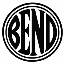 A black disc with the letters BEND in white, drawn with two heavy detached rings and broad smooth letters.