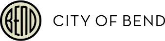 A cream ring enclosing the word BEND in narrow letters with an arched third letter.