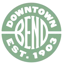 A green circular badge with white BEND letters, DOWNTOWN above and EST. 1903 below.