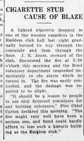 A newspaper column headed “Cigarette Stub Cause of Blaze”, reporting a fire in the Emblem club hall and quoting Fire Chief Carlon calling the club a historic building.