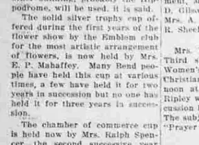 A newspaper paragraph describing the solid silver trophy cup offered by the Emblem club for the most artistic arrangement of flowers, now held by Mrs. E. P. Mahaffey.