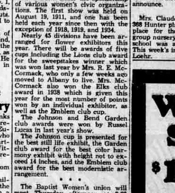 A newspaper column reporting that the first flower show was held on August 19, 1911 and one each year since except 1918, 1919 and 1934, and listing five cups including the Emblem club award for the best modernistic arrangement.