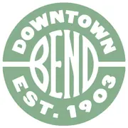 A green circular badge with white BEND letters, DOWNTOWN above and EST. 1903 below.