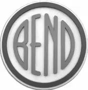 A grey emblem with relief shading: narrow letters spelling BEND inside a heavy grey ring on white.