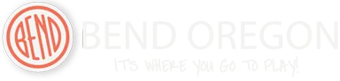 An orange ring enclosing the word BEND in narrow letters, the third a capital N, beside the words BEND OREGON.